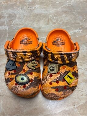 Toddler size 7 CROCS Clogs Jurassic World Dinosaur Orange Shoes